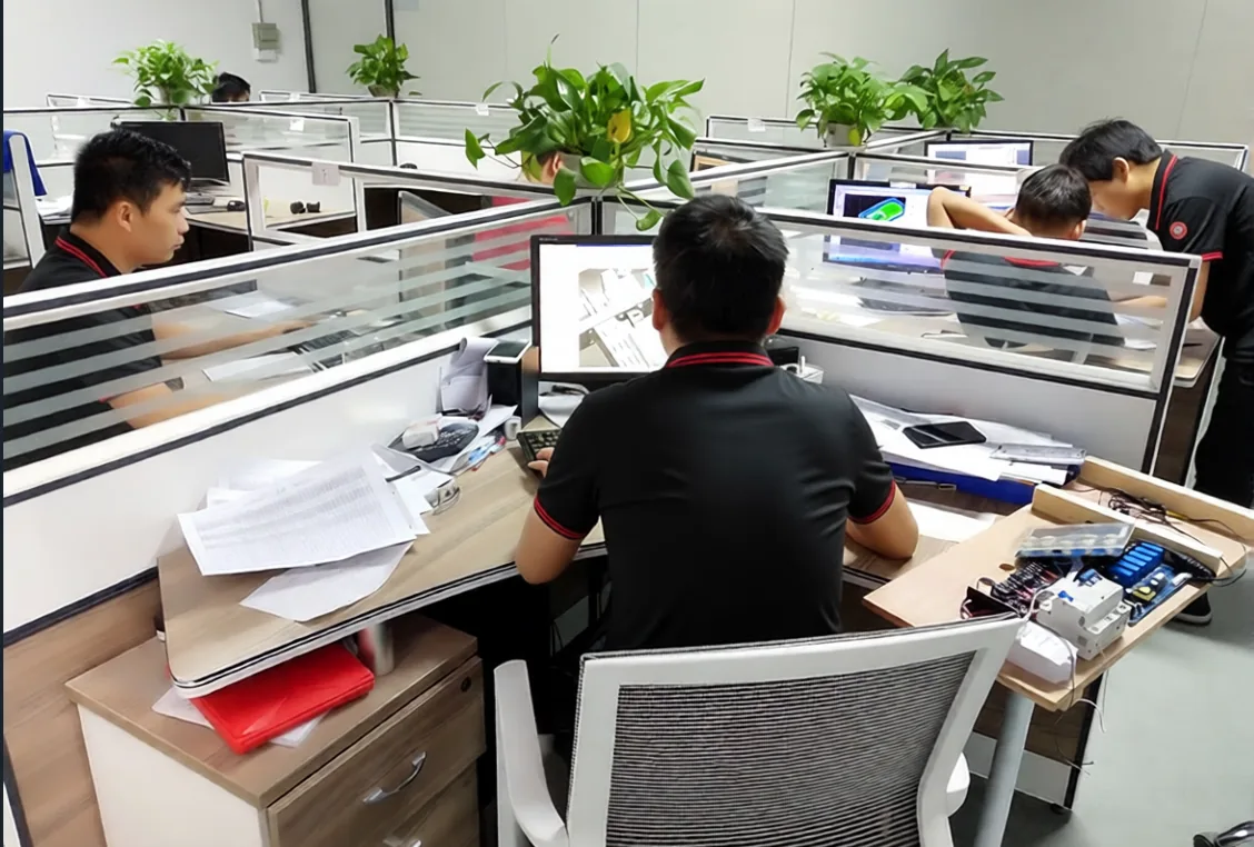 JADMAKE engineering team reviewing CNC machining drawings for quality requirements